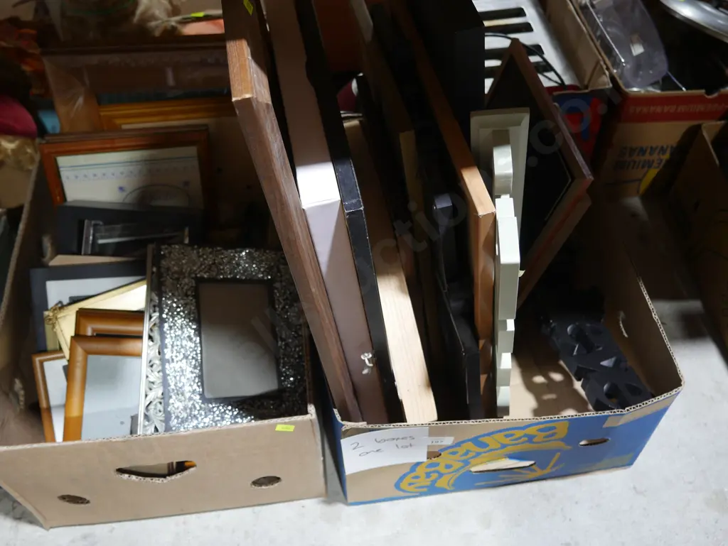 Two boxes of photo frames etc Image 1++