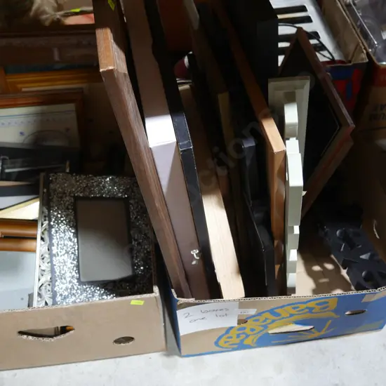 Two boxes of photo frames etc