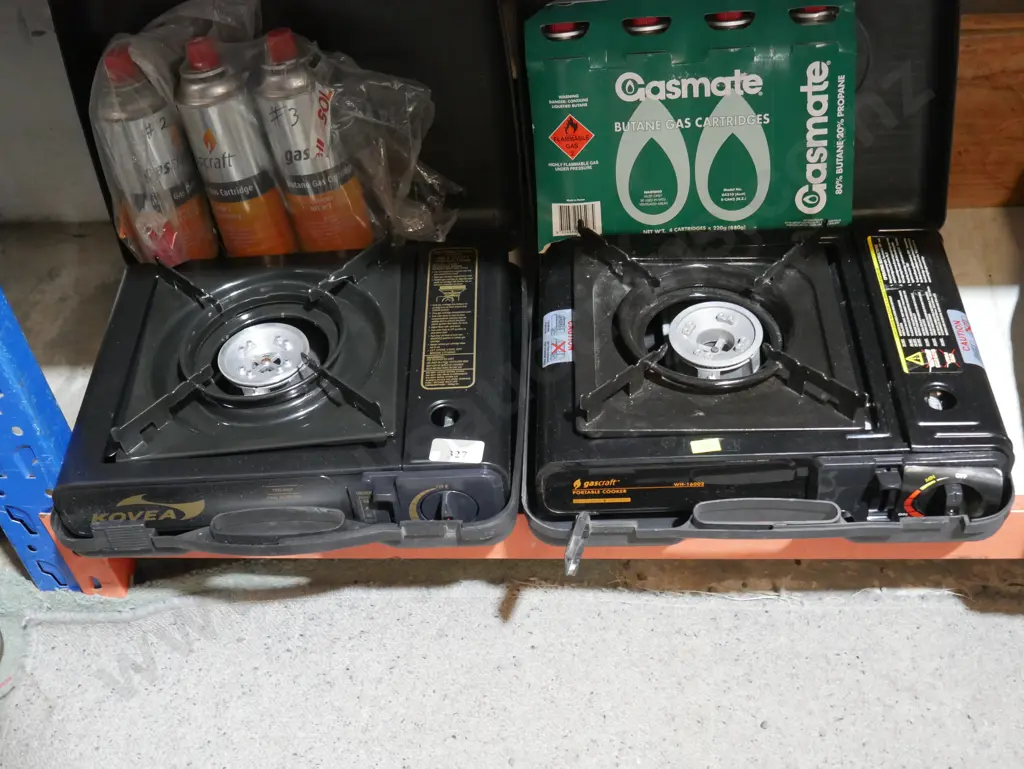 Two portable cookers and butane gas cartridges Image 1++