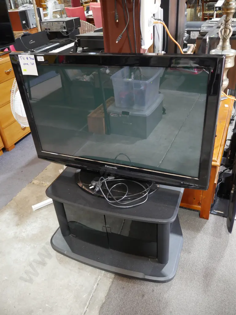 Panasonic 42-in TV and cabinet Image 1++