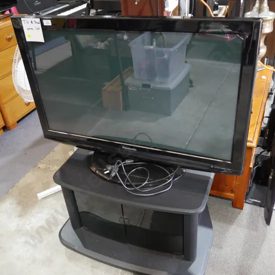 Panasonic 42-in TV and cabinet