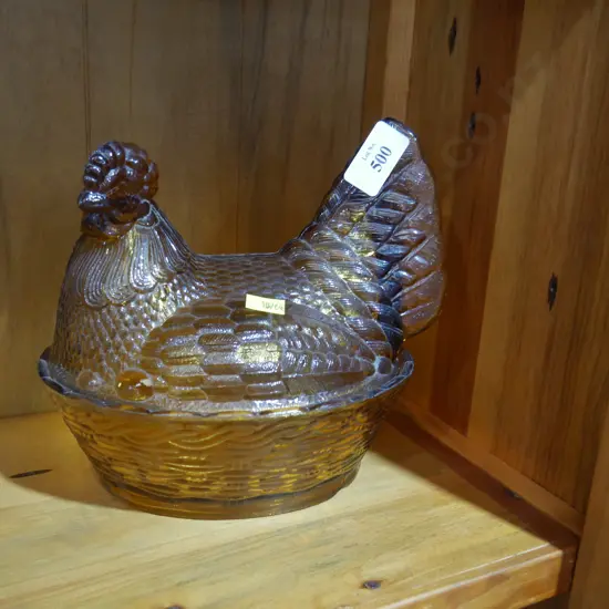 Amber glass hen on nest covered dish