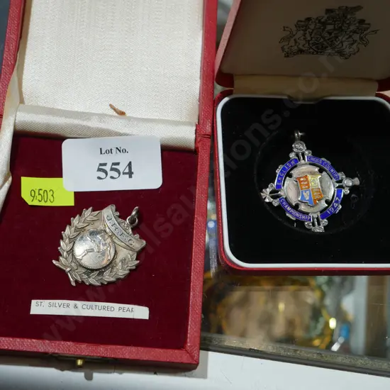 2 sterling silver medals, football and athletics