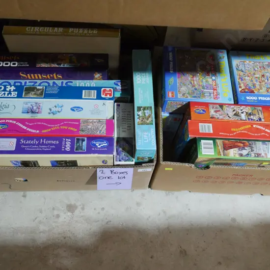 Two boxes of jigsaw puzzles