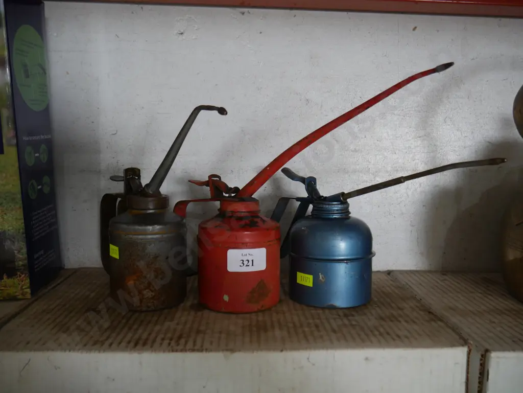 Three oil cans Image 1++