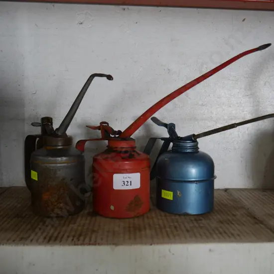 Three oil cans