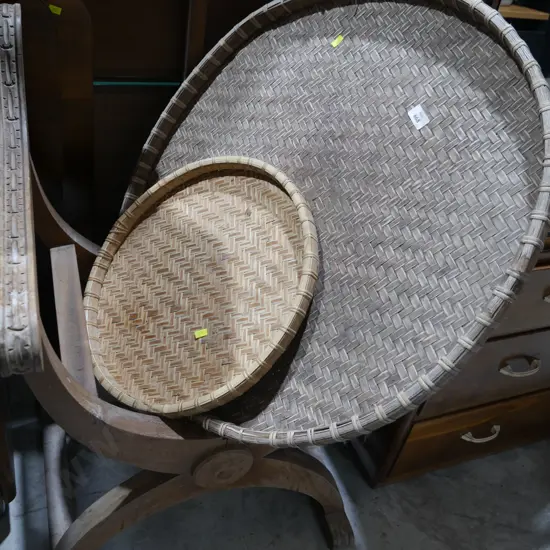 2 wooden chairs and 2 wooven trays