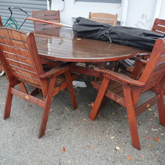 Timber outdoor table and chairs and umbrella