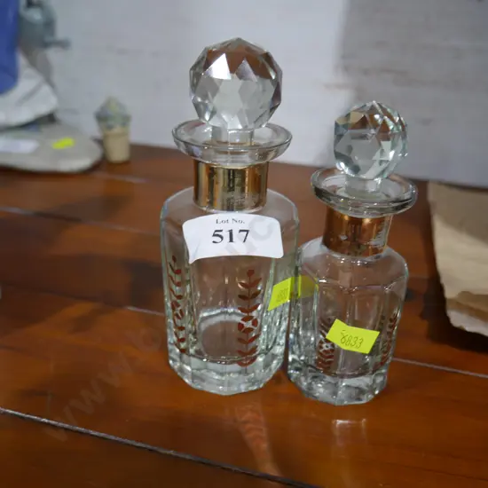 2 small lidded bottles