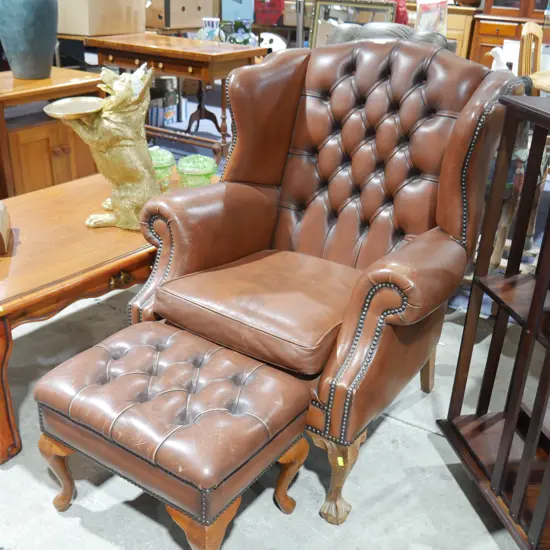 Leather arm chair and footstool