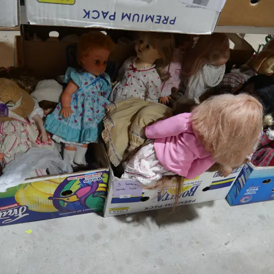 Three boxes of dolls