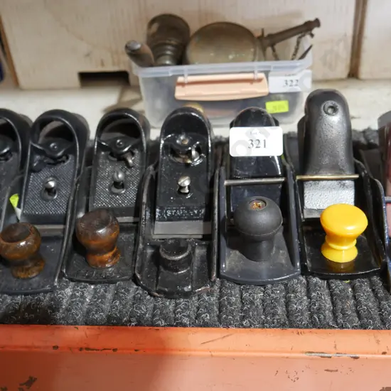 Seven small wood planes