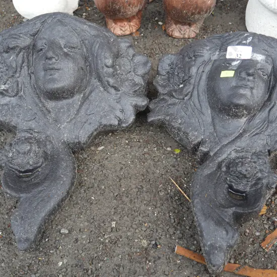 2 lady face wall planters