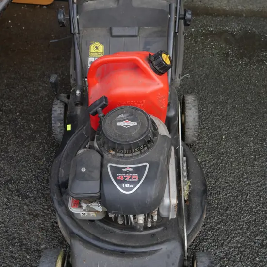 Lawnmower and gas can