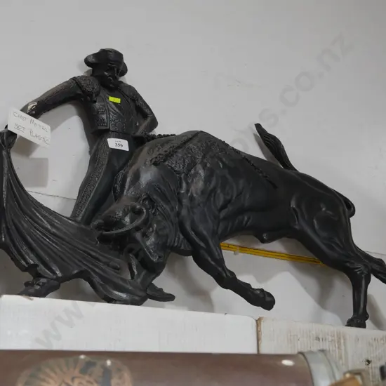 Cast metal matador and bull