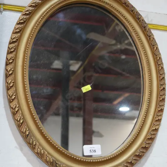 Oval gilt frame mirror