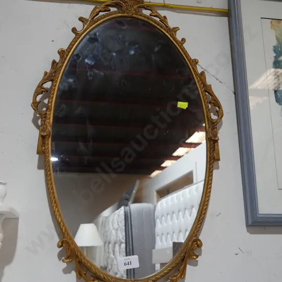 Oval gilt framed wall mirror