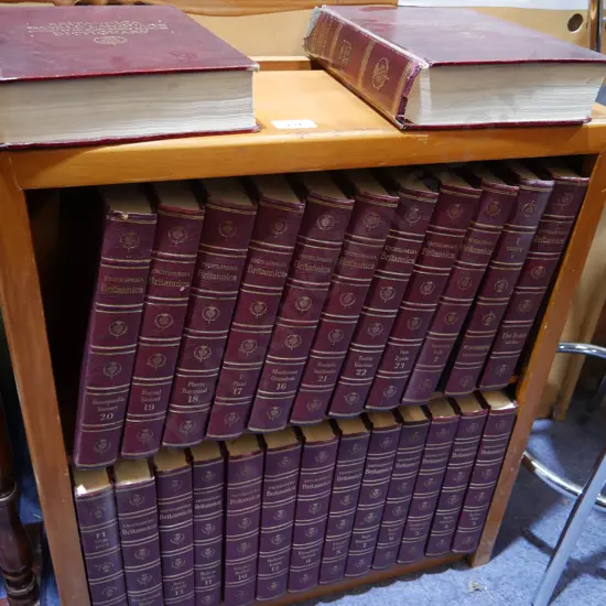 Set of encyclopaedias in bookcase