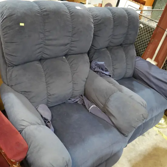 2 blue recliner chairs