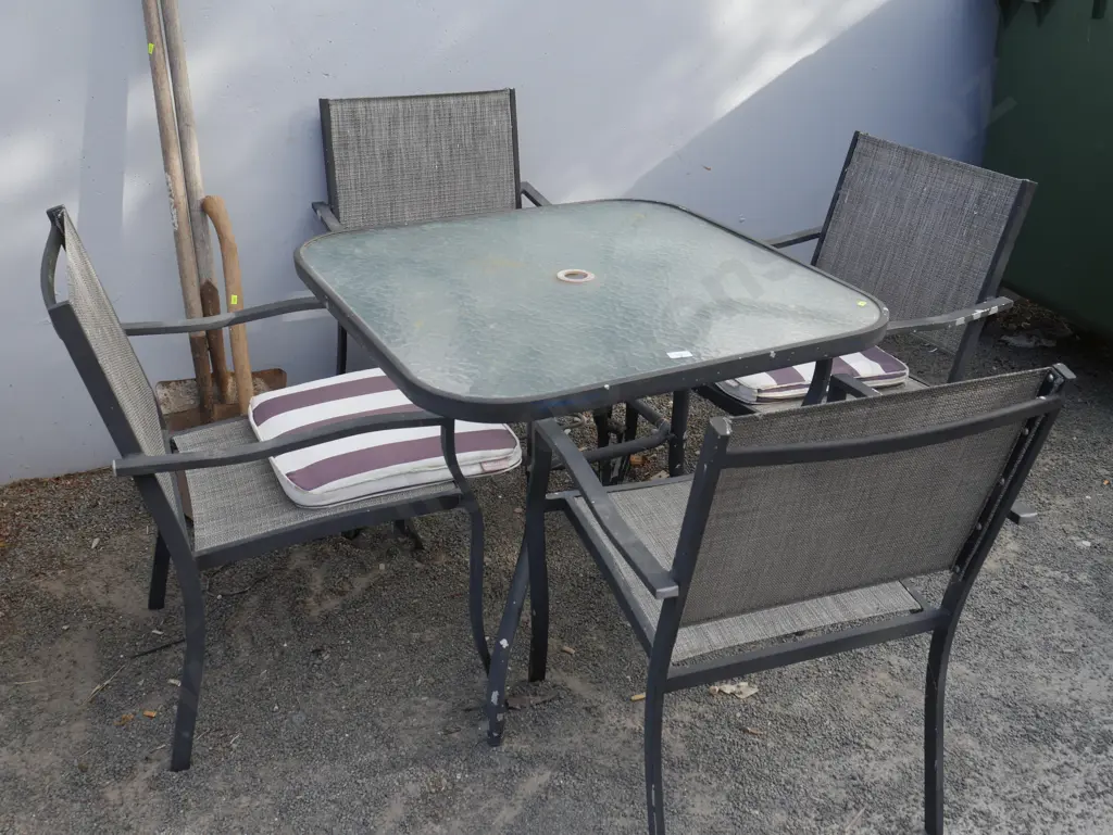 Glass top outdoor table and four chairs Image 1++