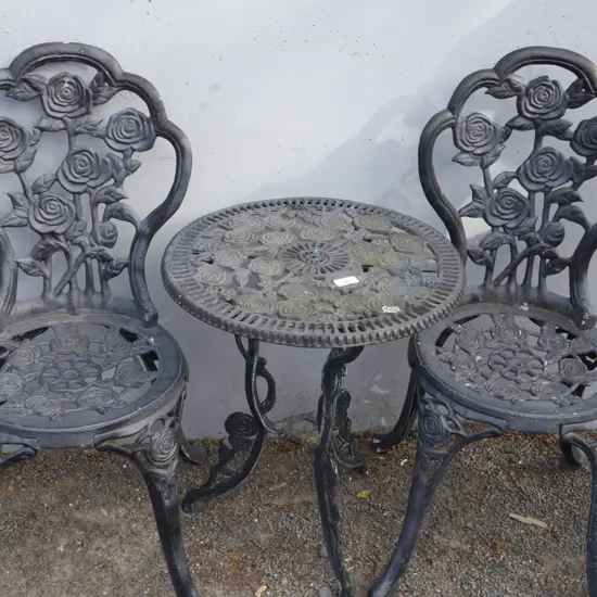 Black metal table and two chairs