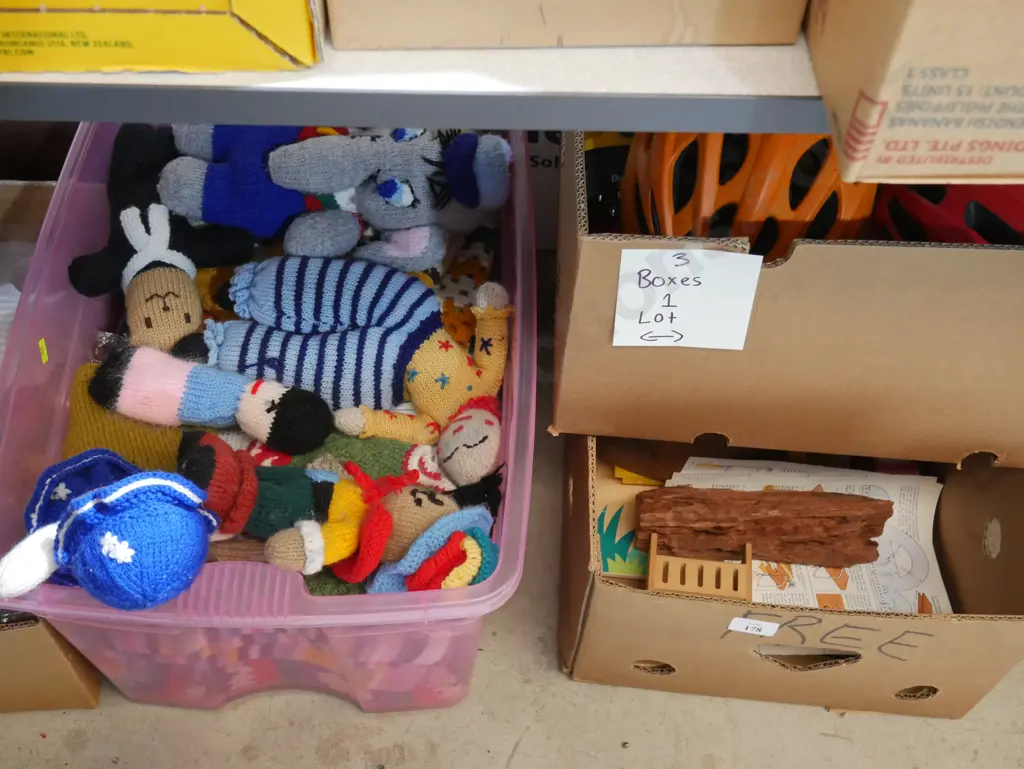 Three boxes of knitted toys, helmets etc Image 1++