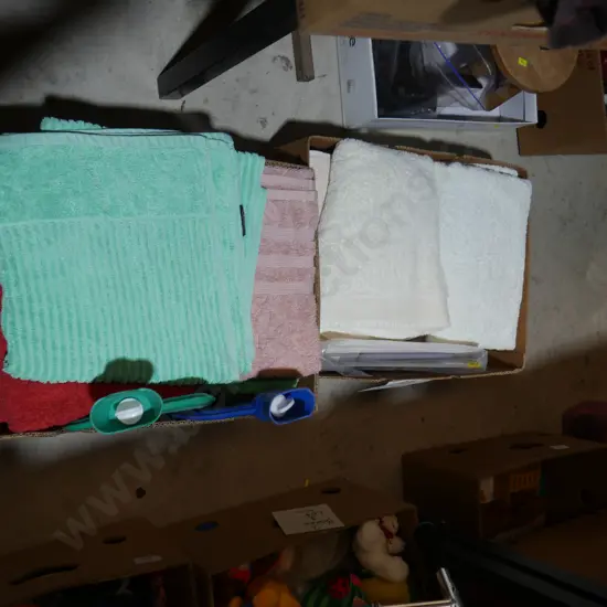 Two boxes of towels etc