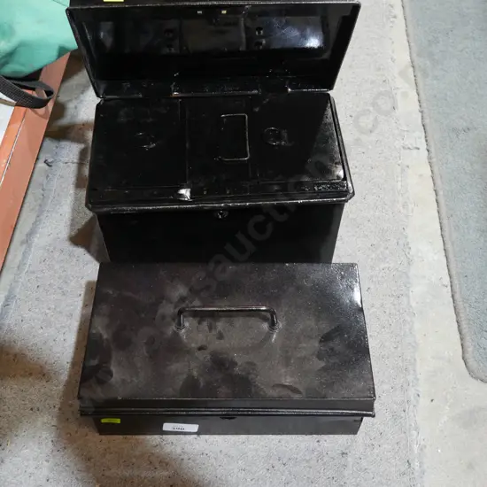Two cash tins