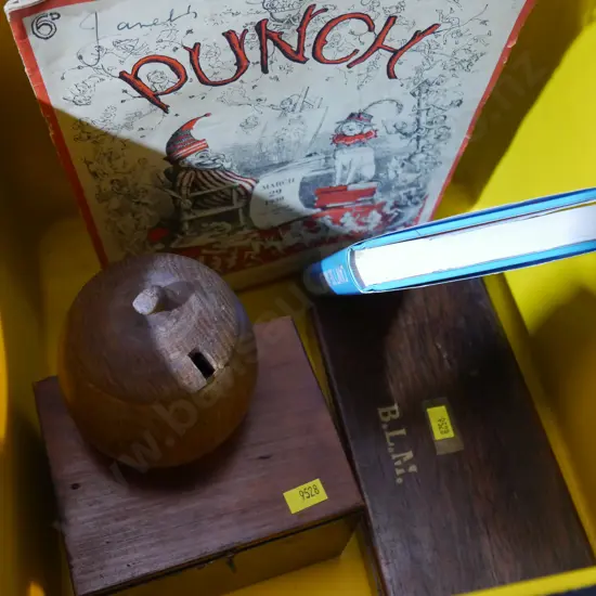 Tub, wooden boxes, books