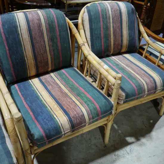 2 cane arm chairs