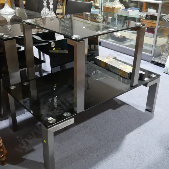 2 glass topped coffee tables