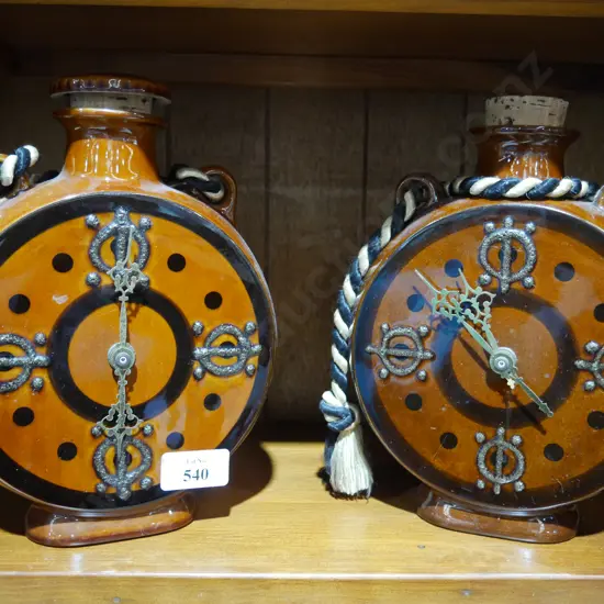 2 pottery clocks