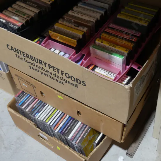 3 boxes of CDs, cassette tapes