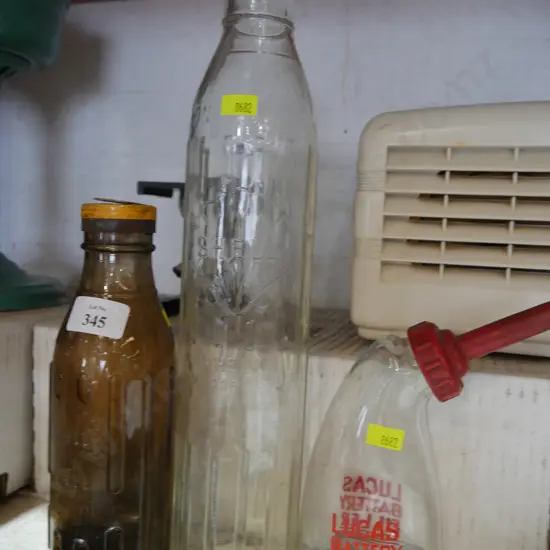 2 shell oil bottles and Lucas battery filler bottle