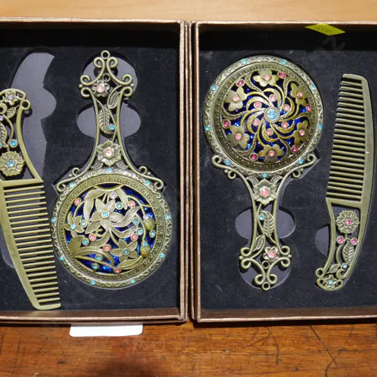 2 boxed hand mirror and comb sets