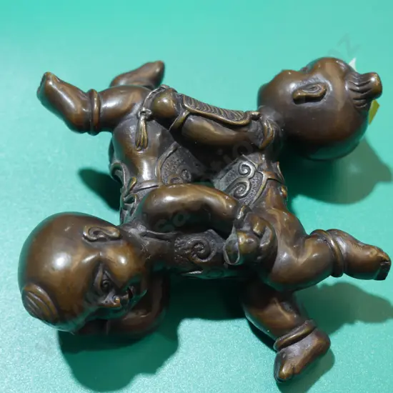 Oriental bronze puzzle figurine