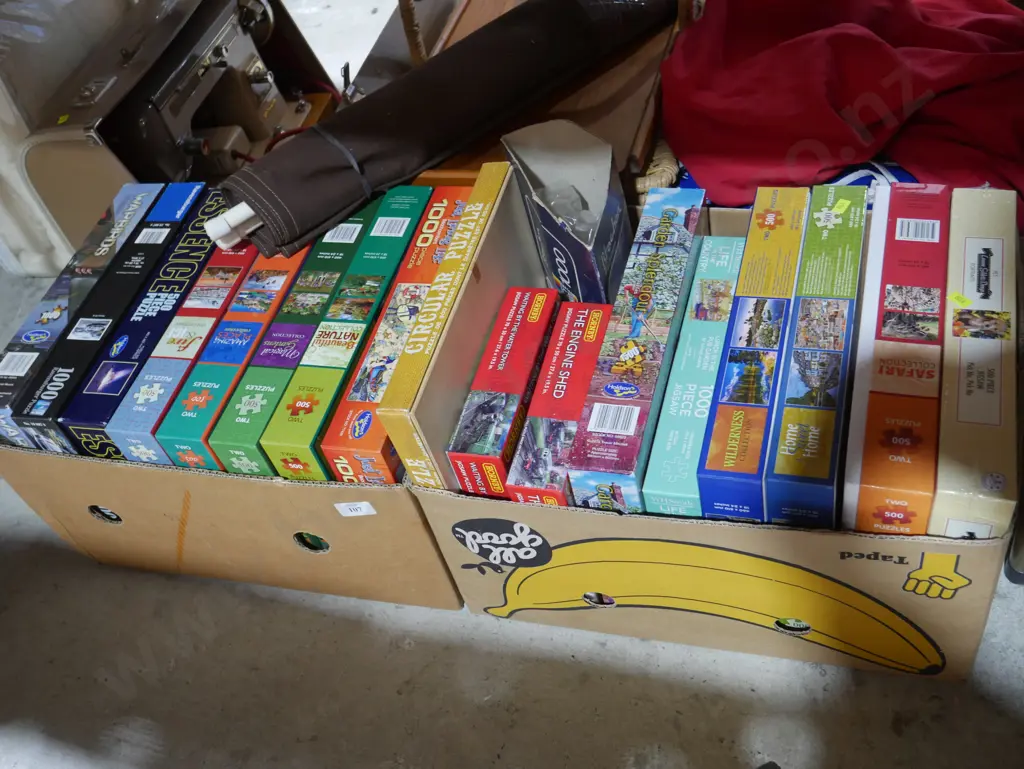 Two boxes of jigsaw puzzles Image 1++