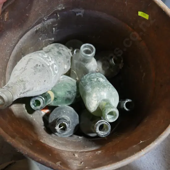Tin bucket, old glass bottles