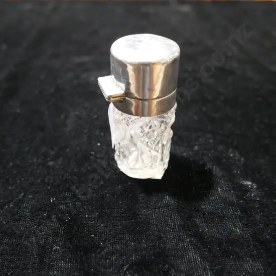 Silver top perfume bottle