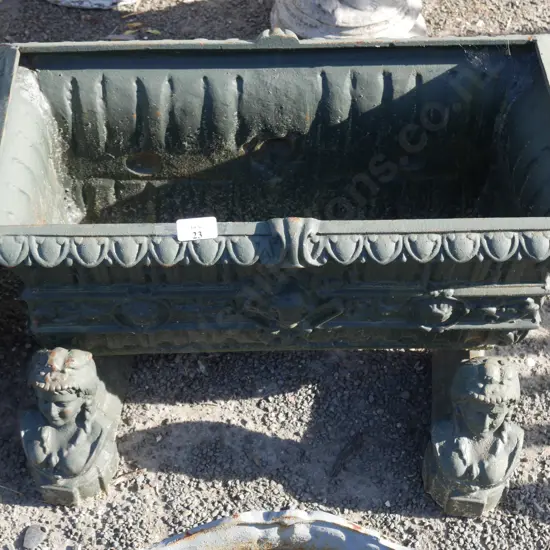 Green cast iron planter with stands