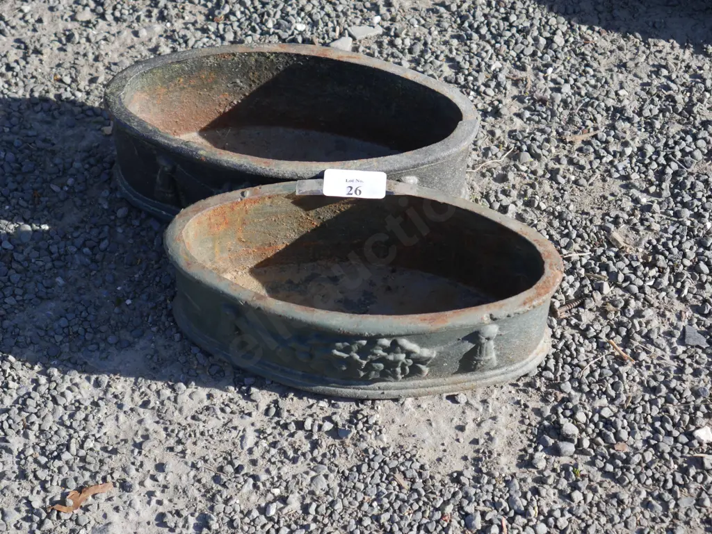 Pair of small cast iron planters Image 1++