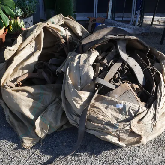 2 sacks of saddles, horse gear