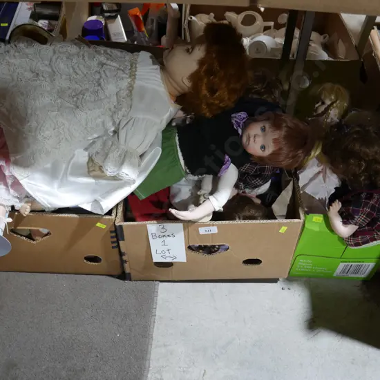 Three boxes of assorted dolls