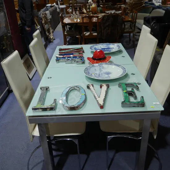 Glass top extension dining table and six chairs