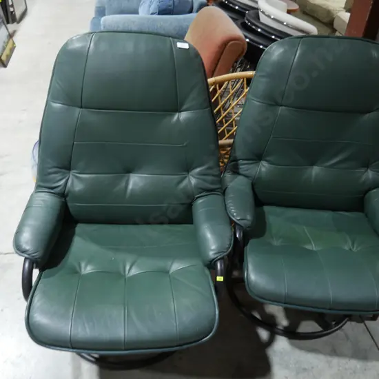 Pair of green swivel armchairs