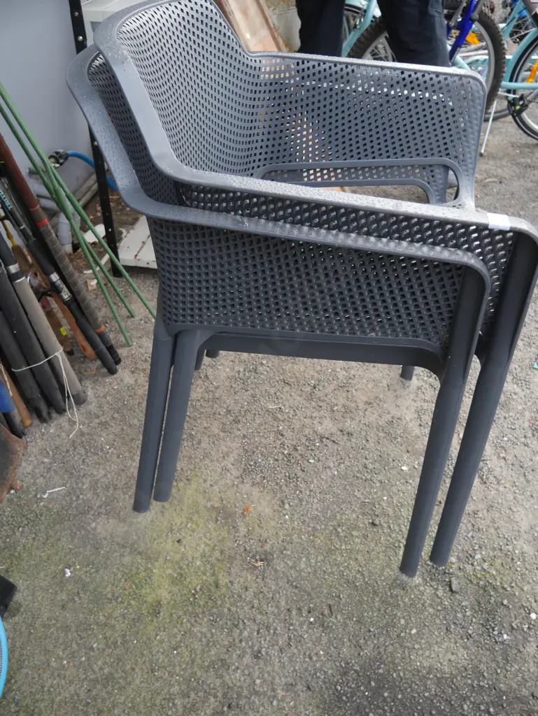 2 grey plastic chairs Image 1++