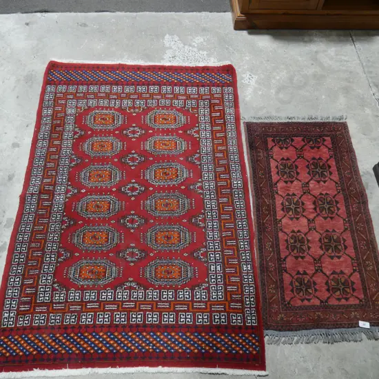 Two hand knotted floor rugs