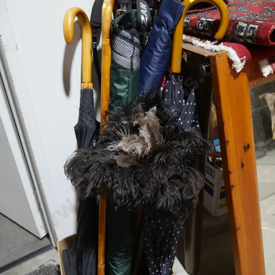 Umbrellas, walking sticks, feather duster