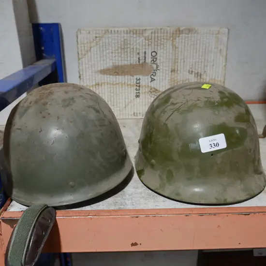 2 military helmets