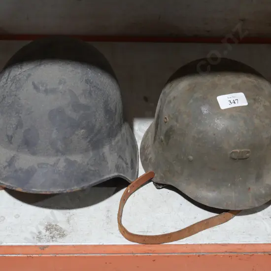 2 military helmets